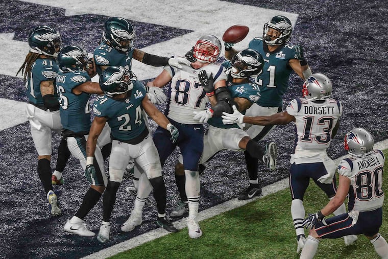 New England tight end Rob Gronkowski (87) can't get a hand on a "Hail Mary" pass as time runs out in the Super Bowl and the Patriots lose 41-33 to the Eagles February 4, 2018.