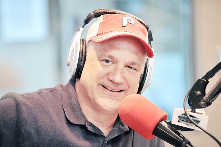 Glen Macnow, of WIP Sportsradio, samples an Italian hoagie at the studio in Bala Cynwyd, in his quest to name the best in the city and talks about on the air in his Bala Cynwyd studio. (Sharon Gekoski-Kimmel / Staff Photographer)