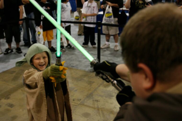 Use the (pop culture) force. Joseph Levengood, 6, of Lebanon, Pa., wields a light saber to do battle with Mike Zhang, 32, a member of a New York Jedi club, at Wizard World Philadelphia.