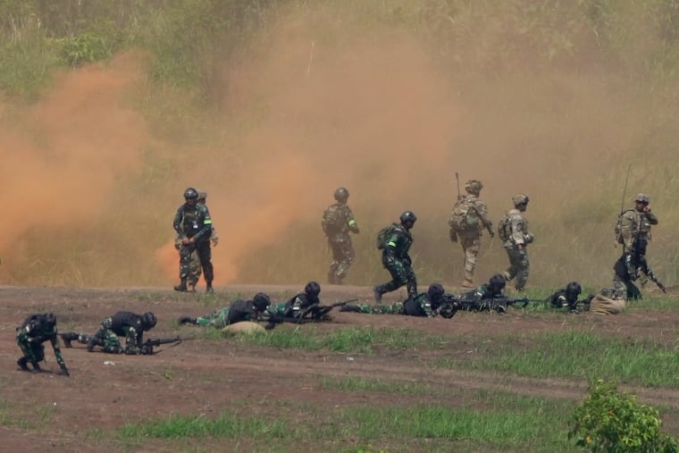 U.S. and Indonesian soldiers take their positions during Super Garuda Shield 2022 joint military exercises in Baturaja, South Sumatra, Indonesia, Friday, Aug. 12, 2022. The United States and Indonesian militaries conducted the annual combat exercises on Indonesia's Sumatra island, joined for the first time by participants from other partner nations including Australia, Japan and Singapore, signaling stronger ties amid growing maritime activity by China in the Indo-Pacific region.