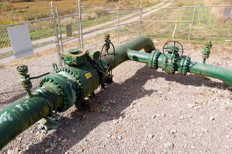 A MarkWest Liberty natural gas pipeline and fracking well cap is seen in Valencia, Pa., in 2020. Millions of Pennsylvanians live within a half mile of an oil and gas well, pipeline, processing facility, or other fracking infrastructure. Many are worried about the effects this infrastructure could have on their health, write Joanne Kilgour and Alison L. Steele.