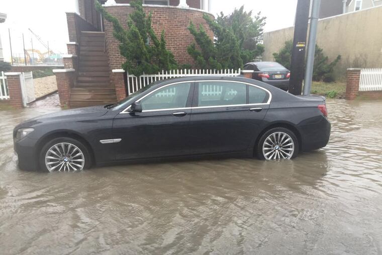 A parked BMW is caught in flood waters at the inlet end of Atlantic Ave. in Atlantic City.