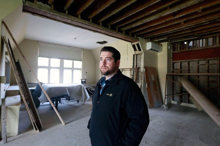 Brad Kenney, executive director of the Moorestown Community House, in the often-used club room.