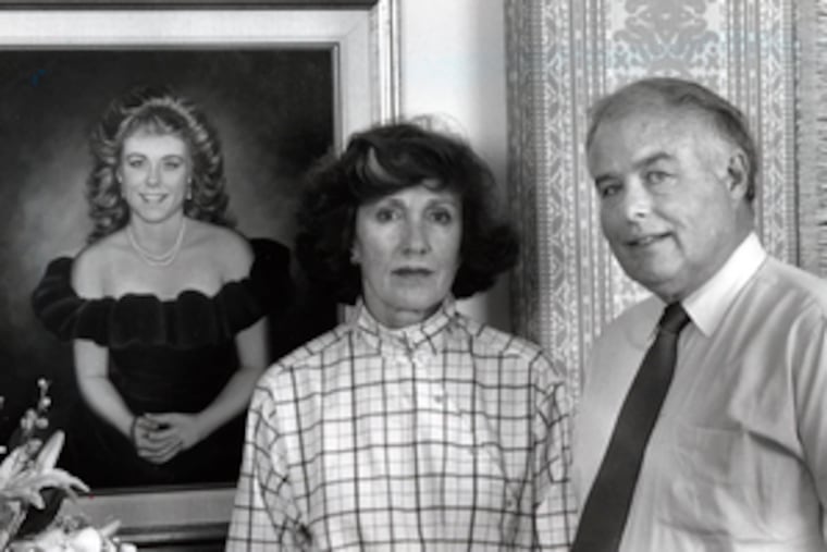 Constance and Howard K. Clery Jr. appear in front of a portrait of their daughter, Jeanne, who was 19 when a burglar murdered her in her Lehigh University dorm room in 1986.