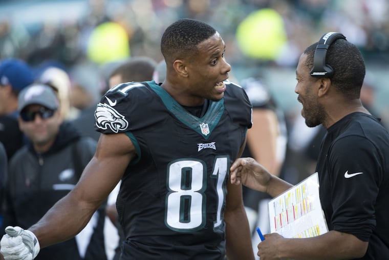 Eagles wide receiver Jordan Matthews talks to Greg Lewis during the Vikings game.