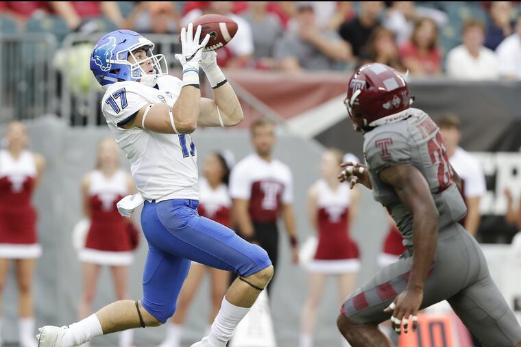 Buffalo wide receiver Charlie Jones catches the football for a first-quarter touchdown past Temple safety Jyquis Thomas on Saturday, September 8, 2018. YONG KIM / Staff Photographer