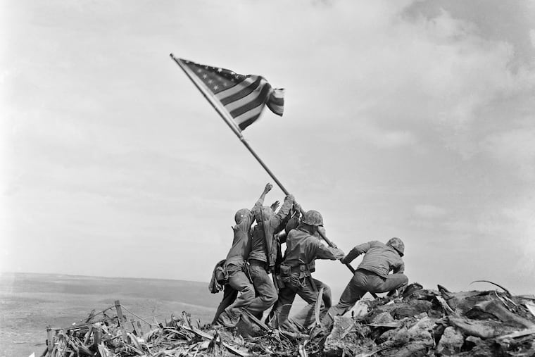 James Bradley's book "Flags of Our Fathers" was inspired by this famous photo of U.S. Marines of the 28th Regiment, 5th Division, raising a U.S. flag atop Mount Suribachi, Iwo Jima, Japan, Feb. 23, 1945.