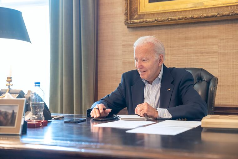 President Joe Biden speaks with Sen. Bob Casey, D-Pa., on the phone from the Treaty Room in the White House on Thursday.