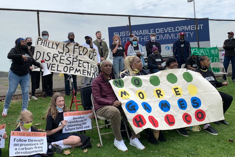 Members of the United South/Southwest Coalition rally in front of the former Philadelphia Energy Solutions oil refinery, now owned by Hilco Redevelopment Partners, on Thursday. Made up of 22 local community organizations, the coalition called on Hilco to commit to negotiating a community benefits agreement that would require the property's redevelopment to confer benefits on the surrounding community.