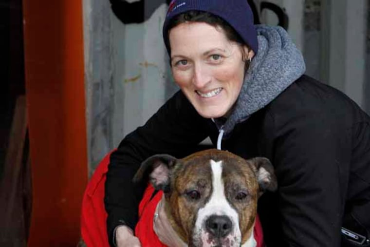 Jen Leary of "Red Paw Emergency." Pet adoption groups set up at the rink for the "With Love" Soul Mate Skate" in hopes of getting animals adopted. February 15, 2014. ( MICHAEL S. WIRTZ / Staff Photographer )