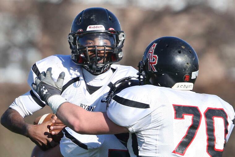 STEVEN M. FALK / STAFF PHOTOGRAPHER Jeremiah Agrio celebrates first-quarter TD with Joe Hansbury (center) and Brian Robbins (right) in Archbishop Ryan's 13-7 win over George Washington.