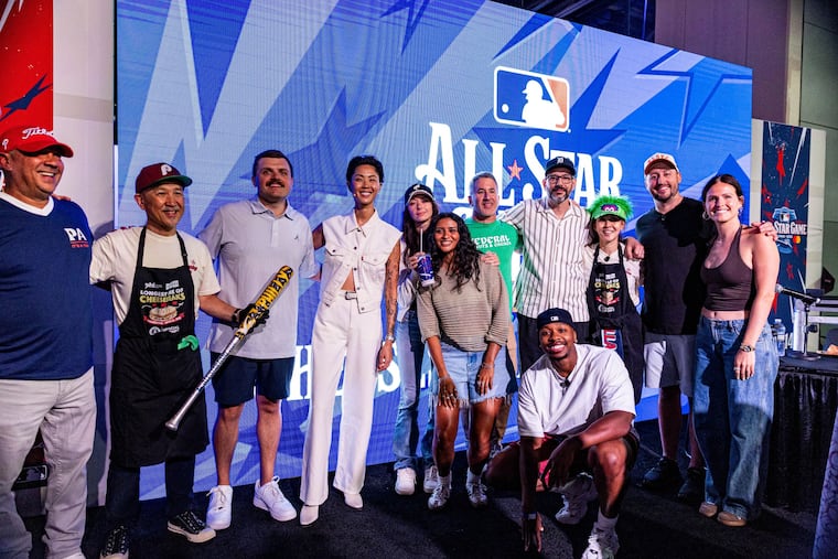 Chefreactions (standing, fourth from right) among judges and contestants at the Cheesesteak Challenge on July 12, 2026, at All-Star Village.