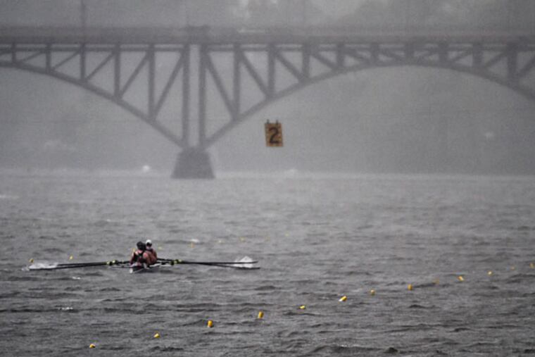Rowers compete in a race during a downpour at the 76th Aberdeen Dad Vail Regatta on the Schuylkill River in Philadelphia, Saturday May 10, 2014. (Joseph Kaczmarek/AP)