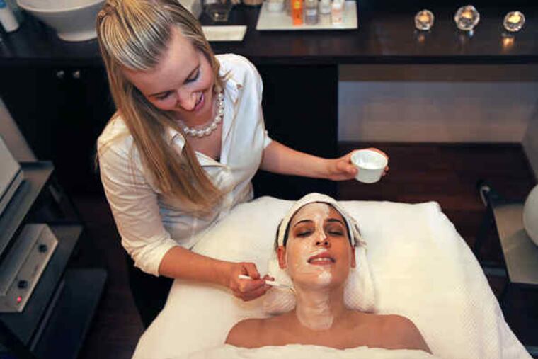 At Rescue Rittenhouse, aesthetician Tirzah Fowler puts a facial mask on Erika Ianoale. A new course teaches proper waxing and client relations.