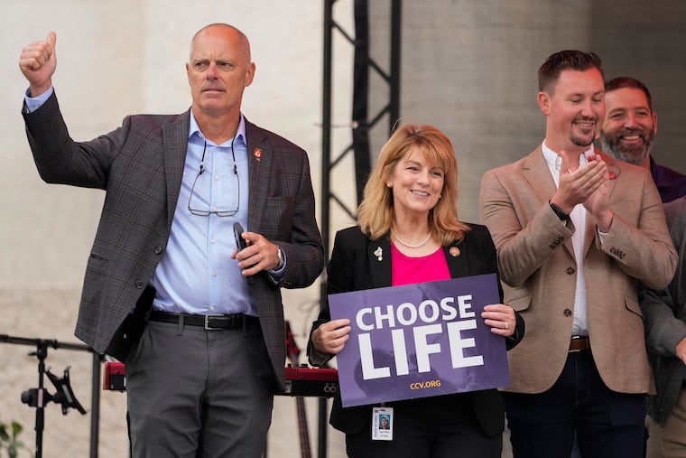 Ohio state Rep. Jennifer Gross (center), holding a "Choose Life" sign, joined by Ohio state Rep. Adam Bird (left) and Ohio state Rep. Thomas Hall, stand together at the Ohio March for Life rally in Columbus, Ohio, last month.