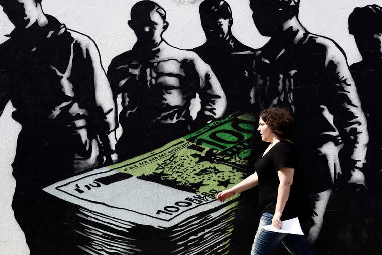 A graffiti artwork titled "Death of Euros," by a French street artist known as Goin, stands on a wall in Athens. Greece's continuation in the eurozone has been a concern for months, even years. This weekend has a deadline on financial aid that may or may not lead to a decision on whether the drachma will return, which would make the eurozone pledge of irrevocable monetary union questionable for other countries.