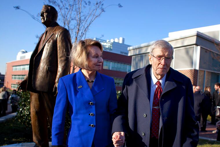 FILE: Henry Rowan and his daughter Ginny Rowan Smith leave a ceremony commemorating the 20th anniversary of his $100 million gift to the institution on December 13, 2012. (ED HILLE / Staff Photographer)