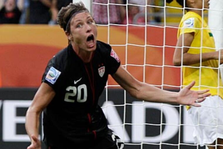 Abby Wambach celebrates after scoring the tying goal just before the end of extra time, forcing a shootout. (Marcio Jose Sanchez/AP)