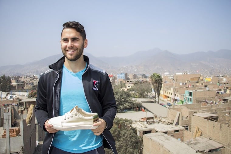 Fernando Rojo, founder of Patos and a new University of Pennsyvlania graduate, with one of his sneakers, handcrafted in Peru.