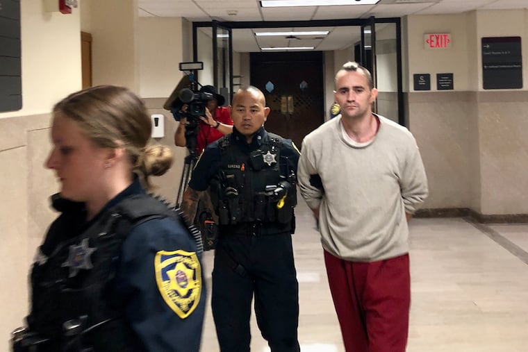 Kenneth Shea is escorted out of a courtroom in the Montgomery County Courthouse on Monday after pleading guilty to first-degree murder.