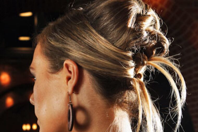 Now that invitations are arriving for holiday parties, it's time to think about your overall look for the coming festivities. Once you know what you're wearing, top off the look with a great hairstyle like this updo. (Fernando Salazar / Wichita Eagle / MCT)