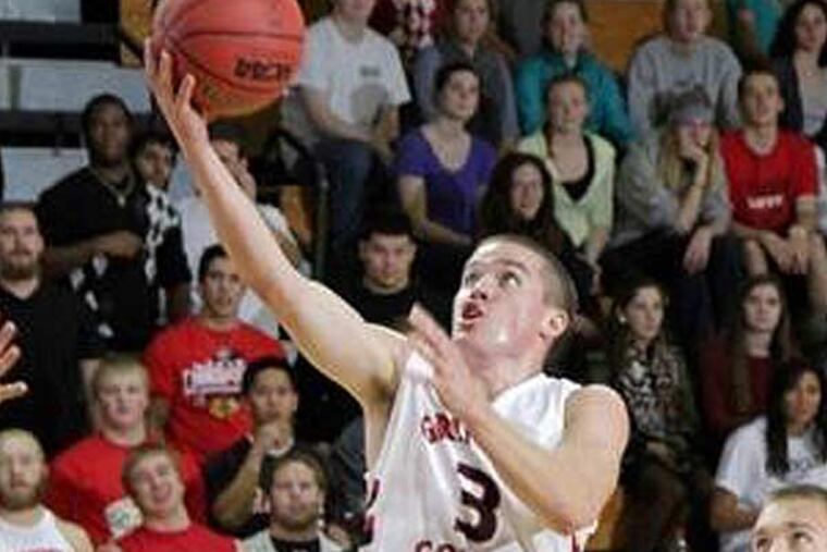 This image provided by Grinnell College shows Grinnell guard Jack Taylor (3) shooting one of 108 shots during Tuesday's Nov. 21, 2012 game against Faith Baptist Bible in Grinnell, Iowa. Taylor scored 138 points to shatter the NCAA scoring record in Division III. (Cory Hall/Grinnell College, AP)