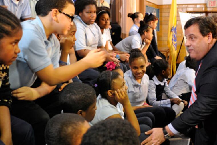 Gov. Christie greets students at the Lanning Square School in Camden after signing the "renaissance" school bill. Newark and Trenton are also included. (Tom Gralish / Staff Photographer)