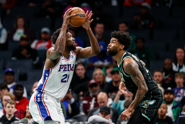 Sixers center Joel Embiid (left) prepares to shoot over Charlotte Hornets center Nick Richards during the first half. Embiid had 38 points Friday night.