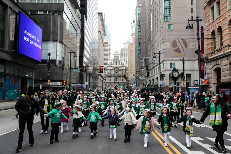 Dancers from the McDade-Cara School of Irish Dance make their way down Market Street during the St. Patrick’s Day Parade in Philadelphia on Sunday.