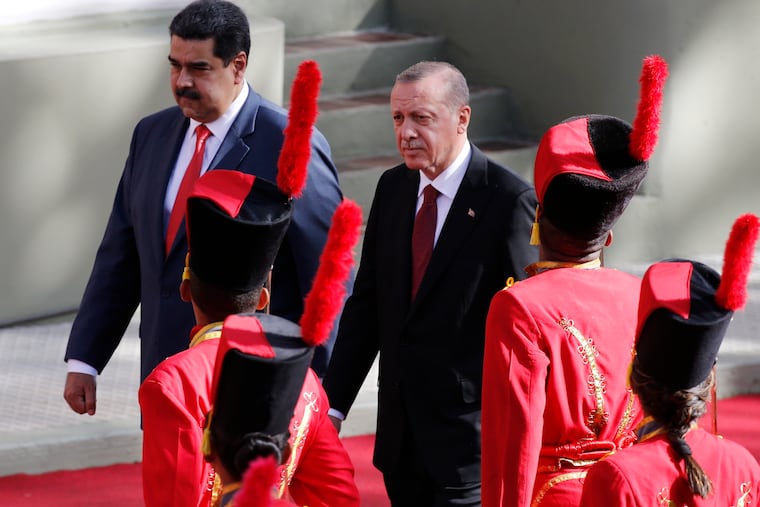 Venezuela's President Nicolas Maduro receives Turkey's President Recep Tayyip Erdogan at the Miraflores Presidential Palace in Caracas, Venezuela, Monday, Dec. 3, 2018. Erdogan is on a one-day official visit to the country. (AP Photo/Ariana Cubillos)