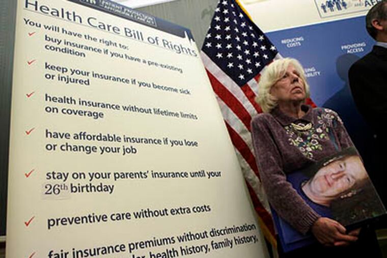 Georgeanne Koehler of Pennsylvania holds a photo of her brother during a health care news conference on Capitol Hill on Monday. (AP Photo / Pablo Martinez Monsivais)