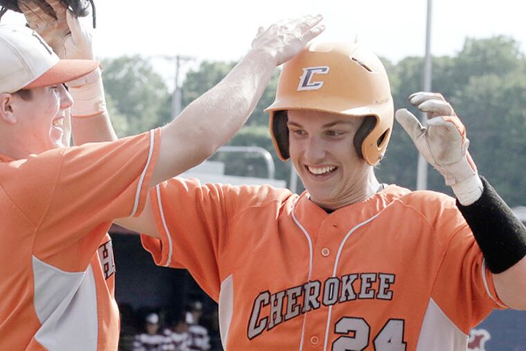 Cherokee's # 24 Mike Borucki is greeted by teammates after he knocked in 2 runs in the 4th inning of the Cherokee at Eastern H.S. South Jersey Group 4 semifinal boys baseball game on JMay 26, 2015. ( ELIZABETH ROBERTSON / Staff Photographer )