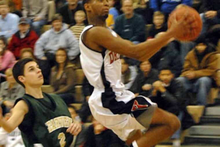 Kingsway's Rondell Gilmore goes for a layup over Clearview's Kevin Burke. (Ron Taver / Staff Photographer)