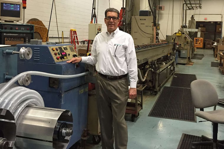 Ken Baker, chief executive of New Age Industries, at a plant assembly line. New Age is now owned by its workers.