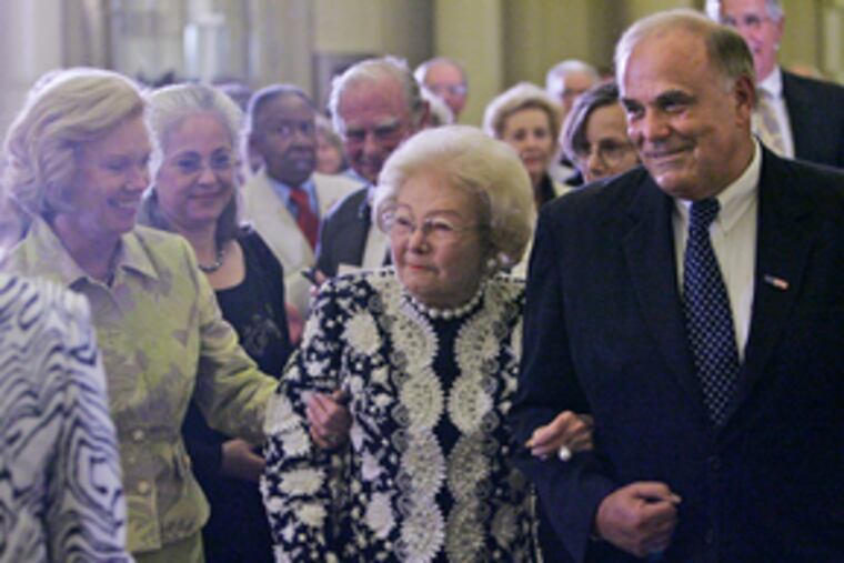 Leonore Annenberg, flanked by Gov. Rendell and his wife, Judge Marjorie O. Rendell, enters the Academy of Music ballroom.