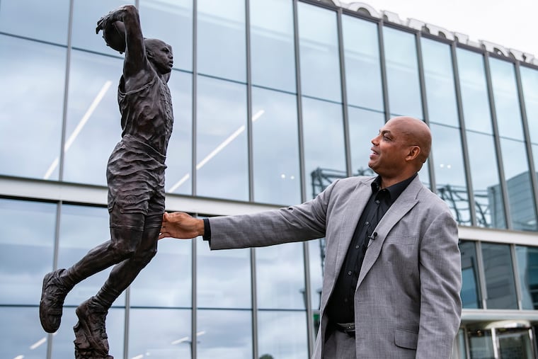 NBA Hall of Famer and former Sixers player Charles Barkley looks at his new sculpture for the first time at the 76ers Legend Walk outside of the franchise's training complex in 2019.