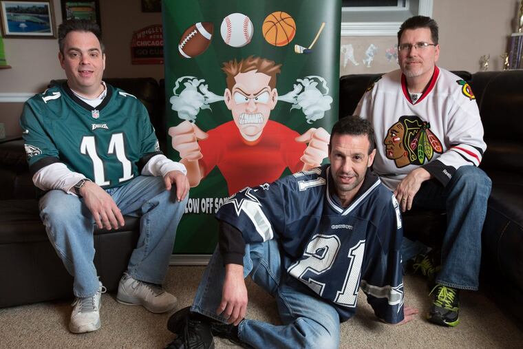 (Left to Right) Jeff Phillips, founder and president; Dan Bagelle, director of promotions; and Tim Wozniak, director of operations, gather in Tim’s man cave, amid a variety of tributes to his beloved sports teams, to watch March Madness games, and vent on their app, in Huntingdon Valley, Thursday, March 16, 2017. These three NE Philly guys, that have been friends since middle school, came up with a classic Philly riff: a Sports Venting app, focused on fans; frustrations, and what teams they hate the most.
