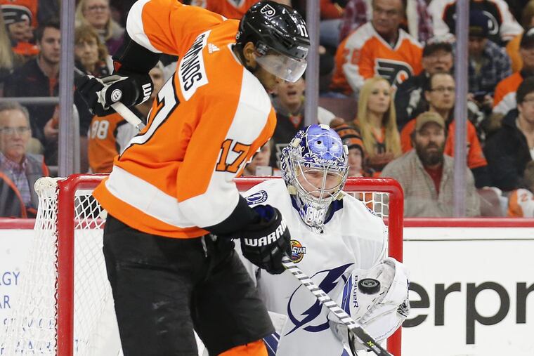 Right winger Wayne Simmonds, shown trying to tip the puck past Tampa Bay goaltender Andrei Vasilevskiy last month, will play in his 500th game with the Flyers on Tuesday in Carolina.
