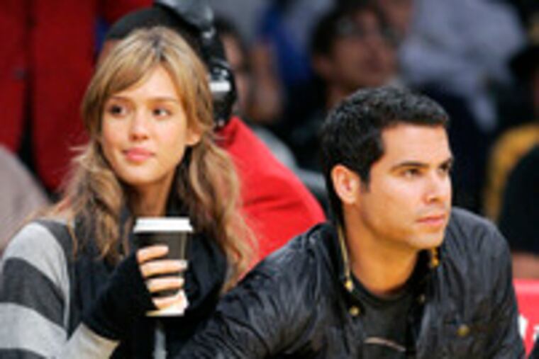 Soon to be a fantastic three: Actress Jessica Alba with Cash Warren at the Warriors-Lakers game Sunday. (See "Alba's dearest creation.")