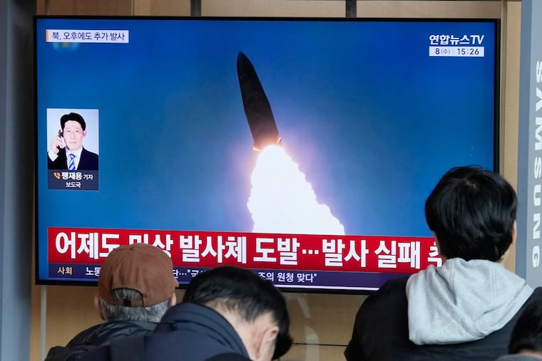 A TV screen shows a file image of North Korea's missile launch during a news program at Seoul Railway Station in Seoul, South Korea, Wednesday, April 8, 2026.