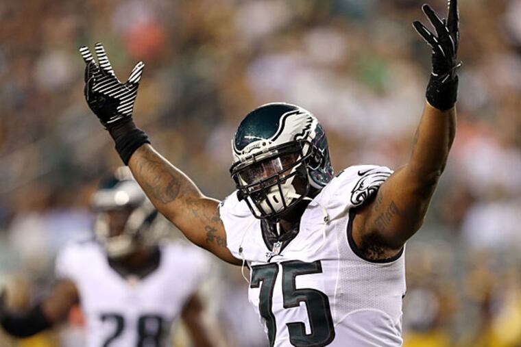 Vinny Curry raises his arms during a preseason game against the Pittsburgh Steelers. (David Maialetti/Staff Photographer)