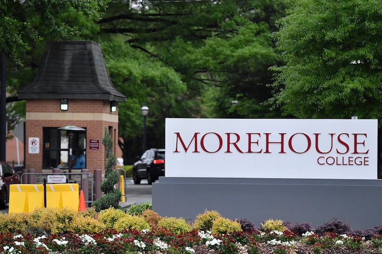 In this Friday, April 12, 2019 photo, people enter the campus of Morehouse College in Atlanta. (AP Photo/Mike Stewart)