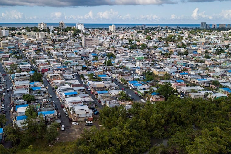 Some homes in the Cano Martin Pena communities in San Juan, Puerto Rico still lack permanent roofs, as seen on Aug. 24, 2018, a year after Hurricane Maria.