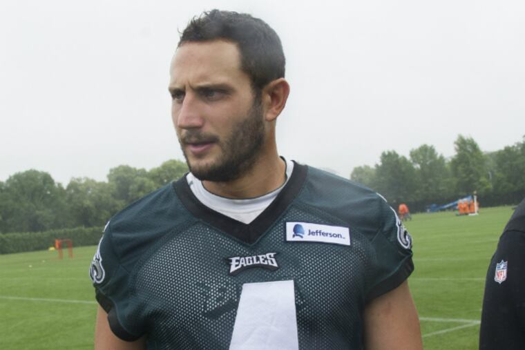 G.J. Kinne walks off the field after practice. (Clem Murray/Staff Photographer)