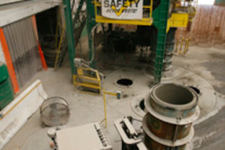 A mold containing a 30-inch pipe is removed at Cayuga Concrete Pipe. The Croydon company has averaged 4 percent annual revenue growth since 2003, including a 20 percent lift in 2005.