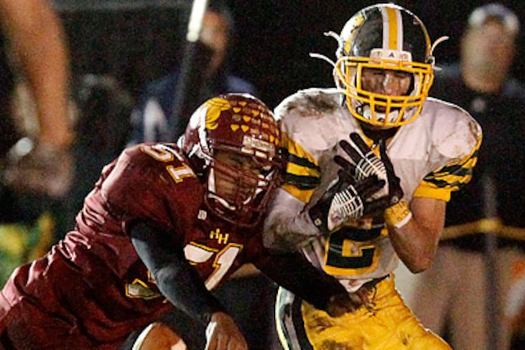 Haddon Heights's Darrian Pierce knocks away a pass intended for Audubon's Christopher Borgesi. (Ron Cortes / Staff Photographer)