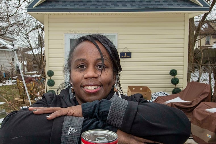 Desiree' LaMarr-Murphy pauses outside what she calls her she-shed, where she stores equipment for the food pantry on her property in Upper Darby. An Inquirer story about her has made her "famous," she says with a laugh, and she's scheduled to appear next month on "The Dr. Oz Show." (Jose F. Moreno/Philadelphia Inquirer/TNS)