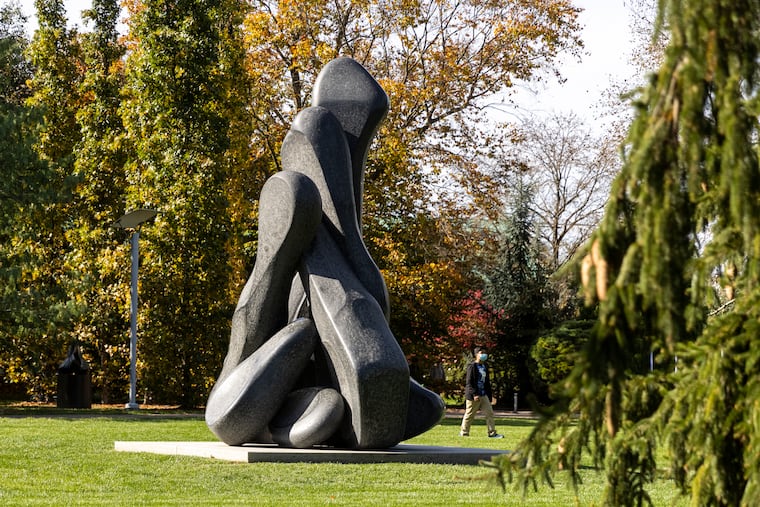 A boy walks by the Garden State made by Isaac Witkin at the Grounds For Sculpture in Hamilton Township, N.J., in November.