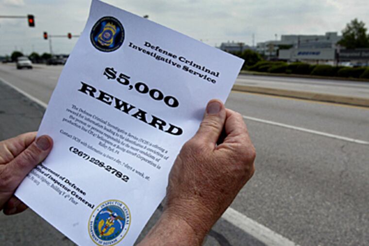 A copy of a reward poster distributed last week to employees at the Boeing Plant Thursday in Ridley Park Pa., where Chinook helicopters were vandalized. (AP)