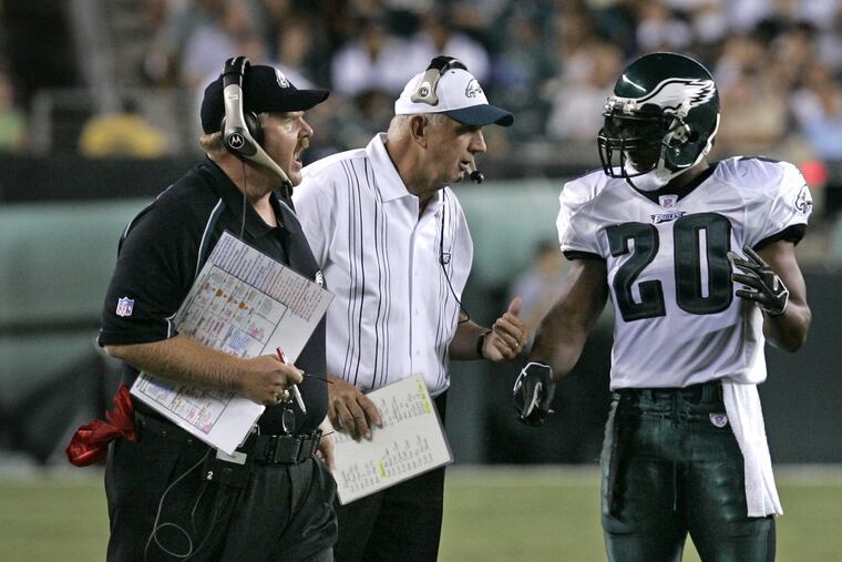 Brian Dawkins played for two defensive coordinators in his time with the Eagles: Jim Johnson (pictured above with Andy Reid in 2005) and Emmitt Thomas.